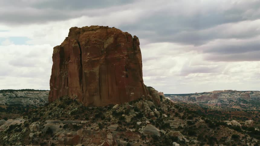 A large rock formation sits above a valley