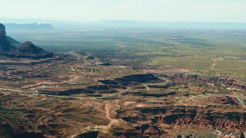 An aerial view of rocky cliffs in nature on a summer day