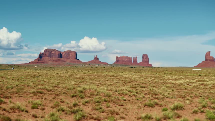 A vast shrub land under a clear blue daytime sky