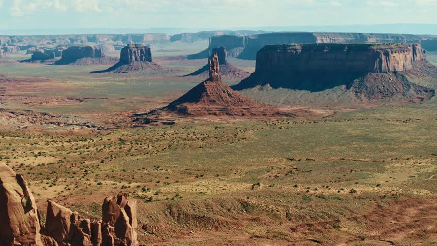 An aerial view of large rock formations in a desert