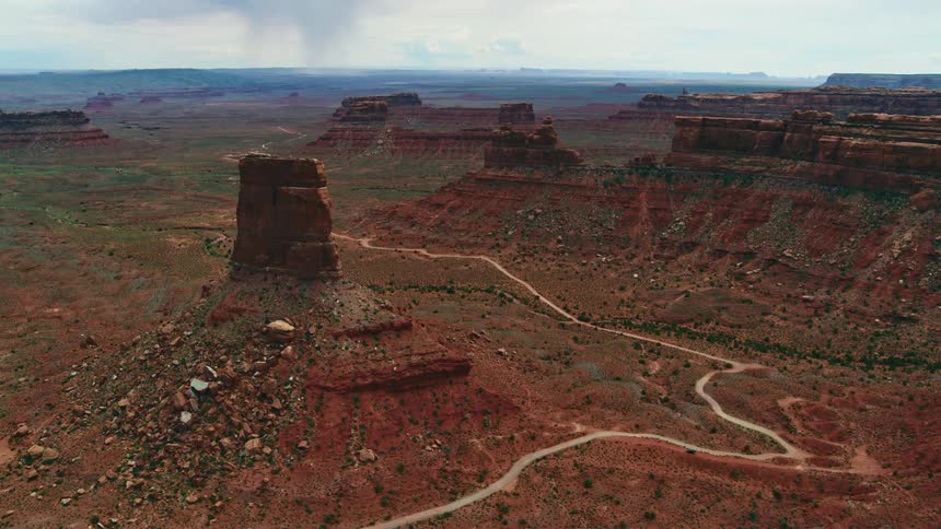 An aerial view of large red rock formations in nature