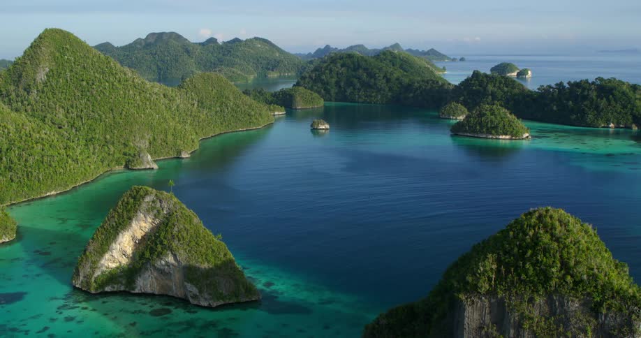 An aerial view of a tropical coastline in the daytime