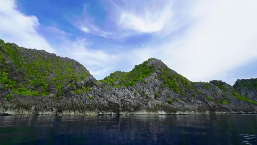 A rocky shoreline on a summer day