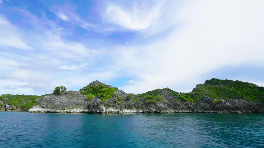 Turquoise ocean water flowing around a tropical island
