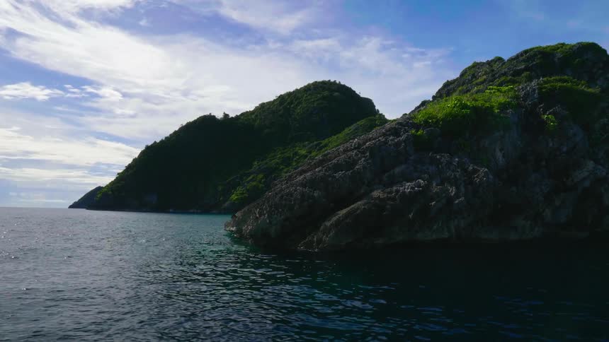 The stone coast of a landmass on a sunny day