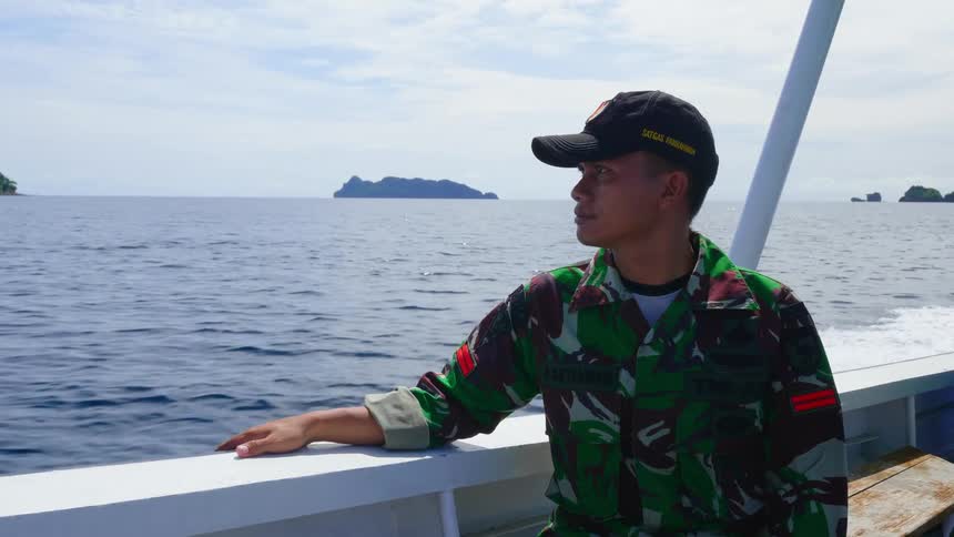 A ranger on a patrol boat