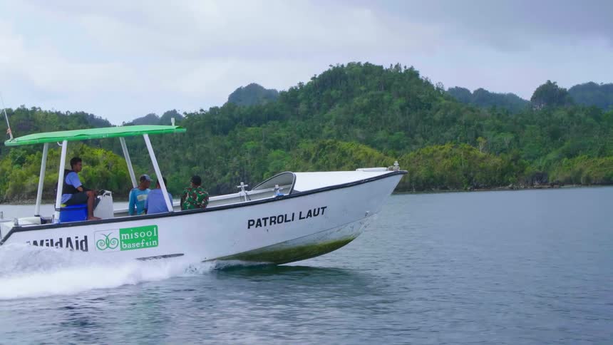 Rangers on a patrol boat