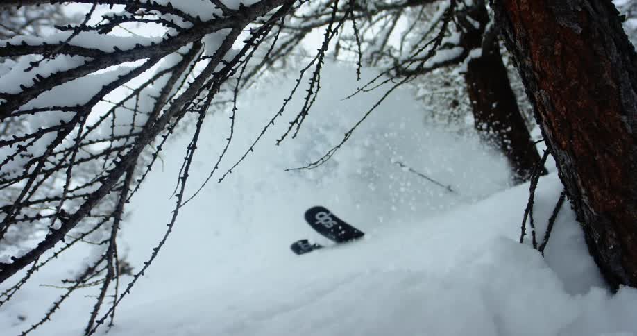 A man is skiing outdoors in winter
