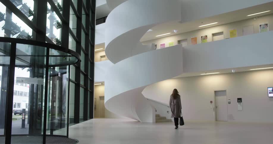A woman walking in an office building
