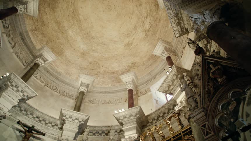A church with statues of saints and a crucifix