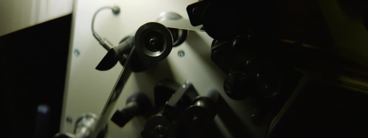 A view of film going over a projector