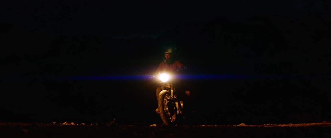 A dirt bike rider stops to gain his footing and takes off