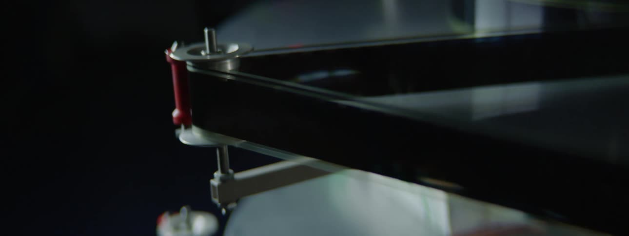 A film strip moving through a vintage projector