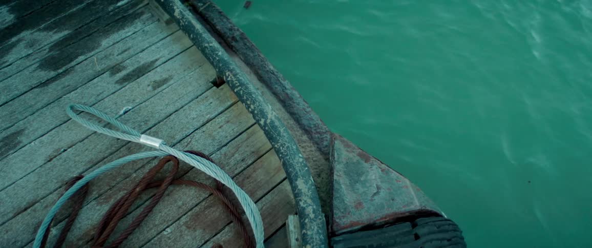 The water at the edge of a dock