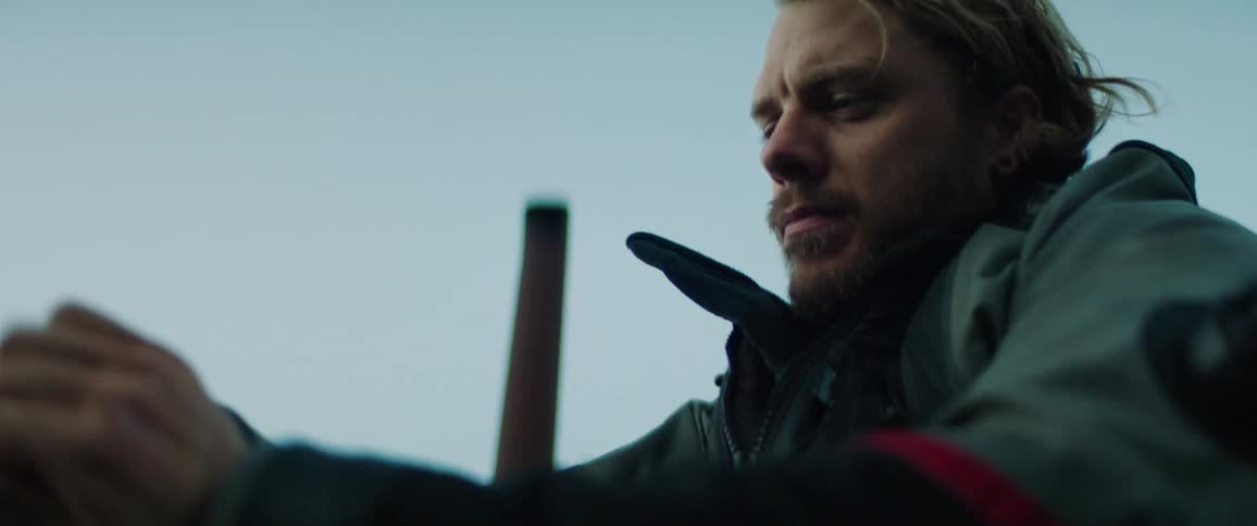 A man is adjusting his coat