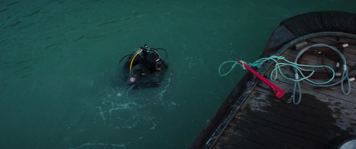 A diver jumps in the water