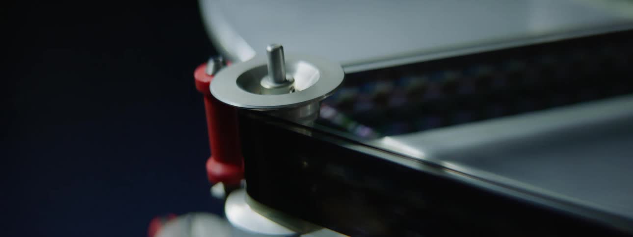 A film strip moving through a projector