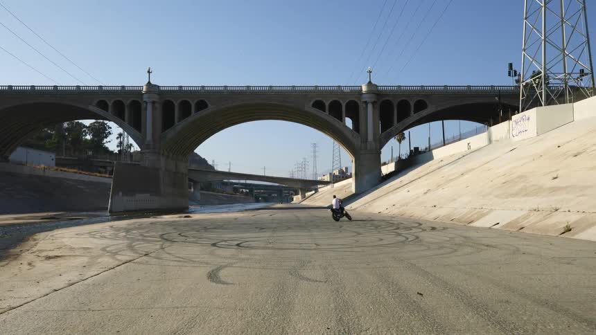A person is riding a motorcycle outdoors in the daytime