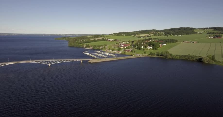 A bridge over a large body of water and the shoreline