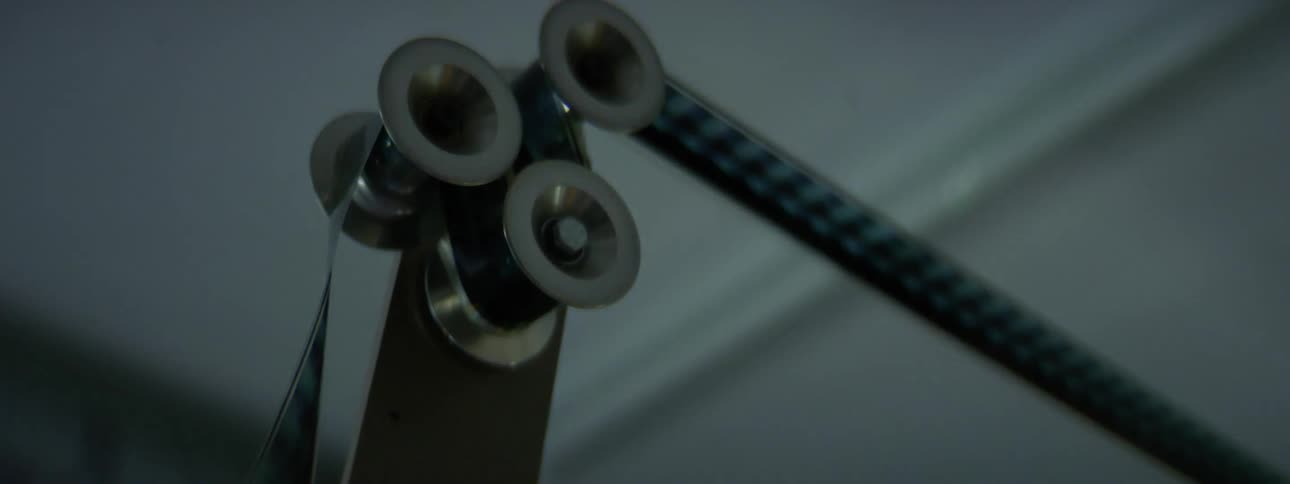A bunch of film going over reels in a projector