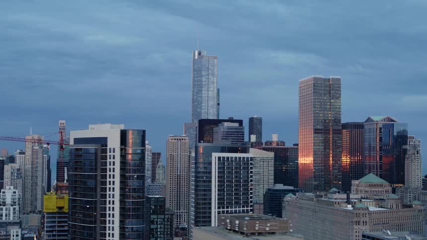High rise offices in Chicago reflecting sunset