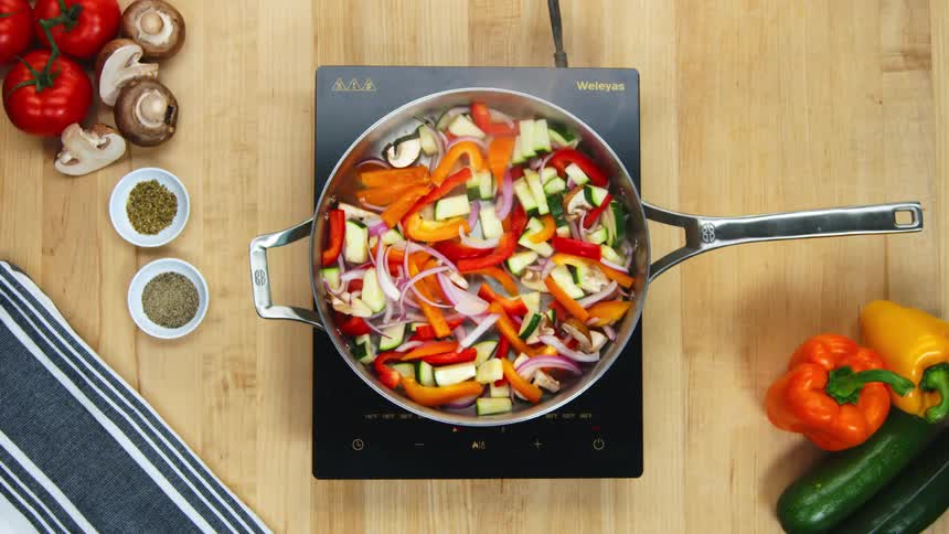 A person is cooking food in a frying pan