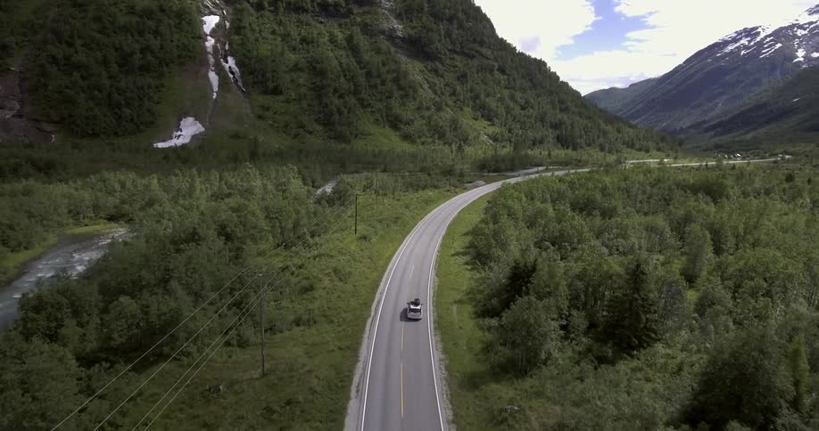 A car traveling along a winding mountain road