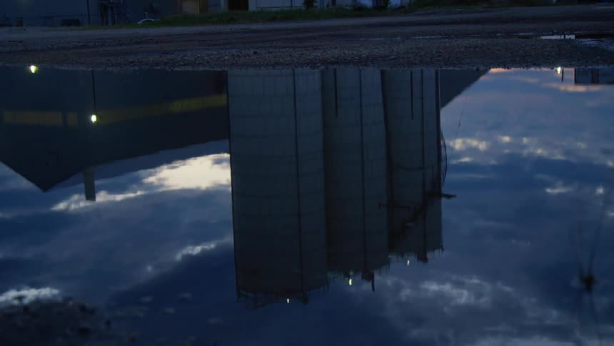 The reflection of a factory in the water