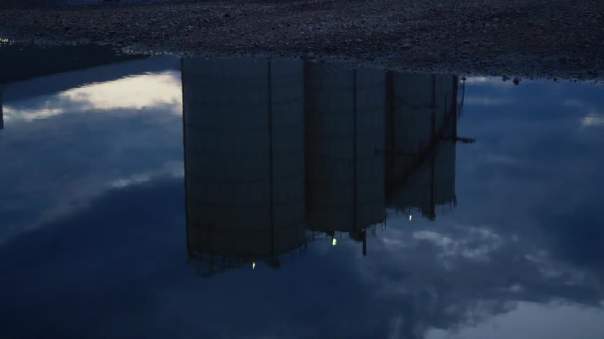 The reflection of a factory in the water