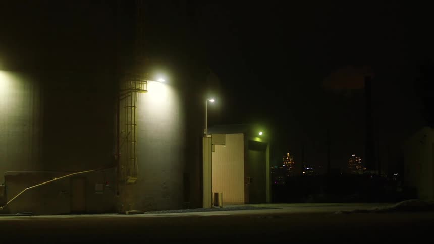 Illuminated light fixtures on a building at night