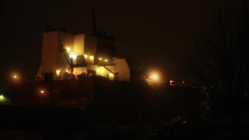 A factory lit up at night