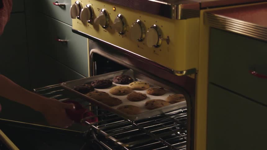 A woman is baking cookies