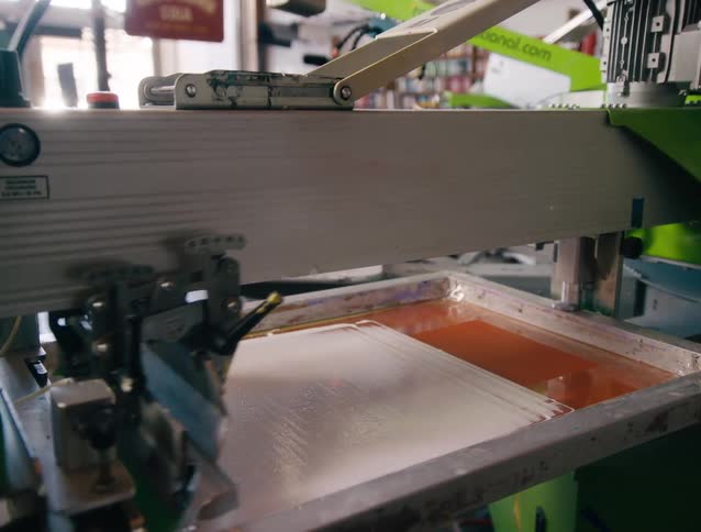 A machine in a factory printing signs
