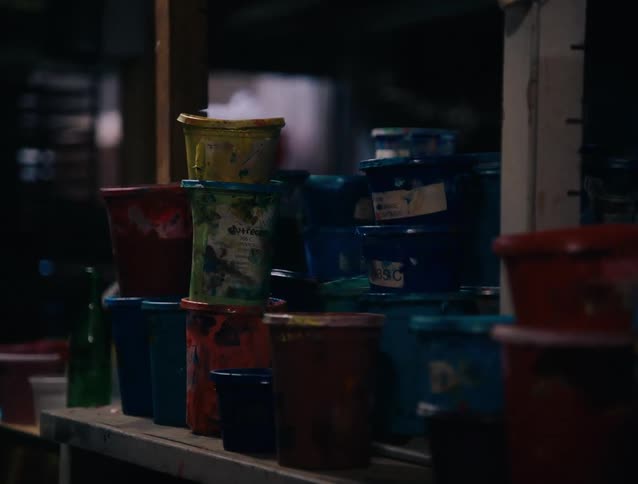 The counter is full of paint cans