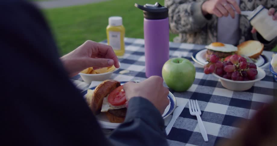 People are eating food outdoors in spring