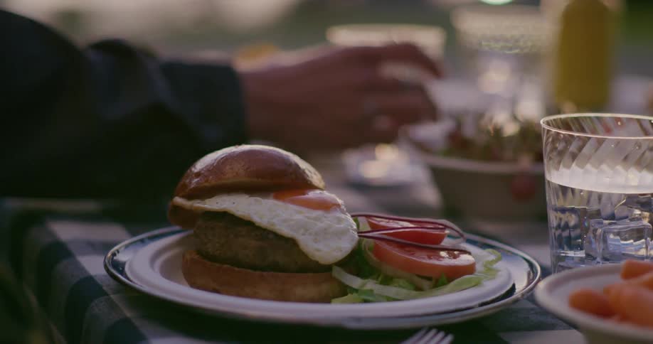 A person is eating food outdoors