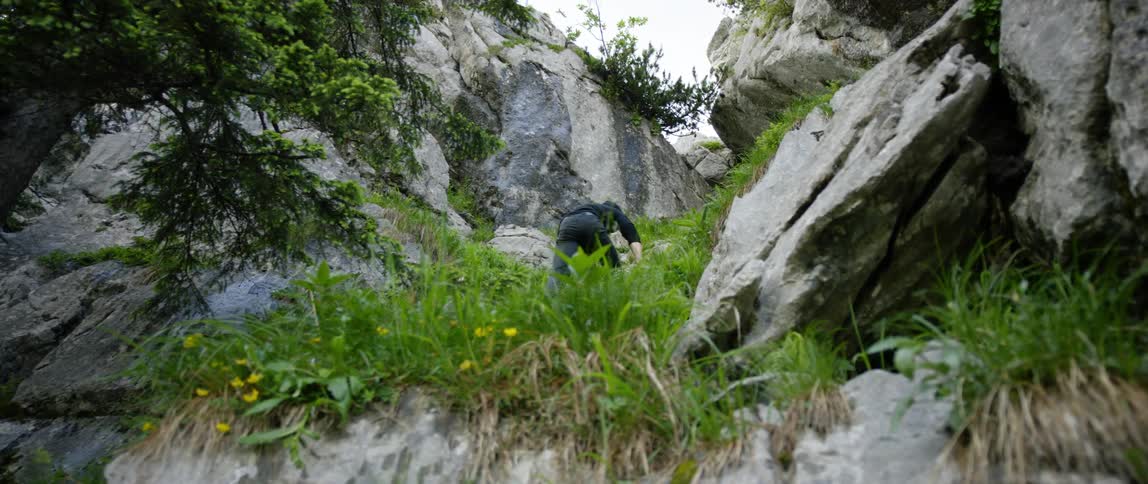 A person is hiking up the mountain