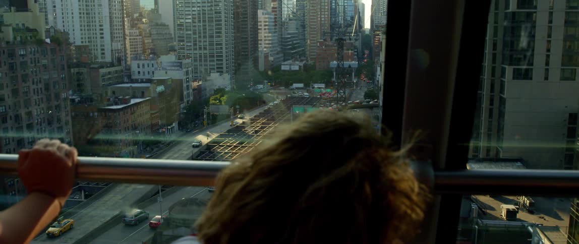Someone is looking out of a window towards the city center