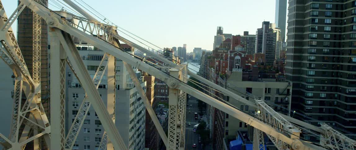 The supports of a large bridge in a metropolis during the day