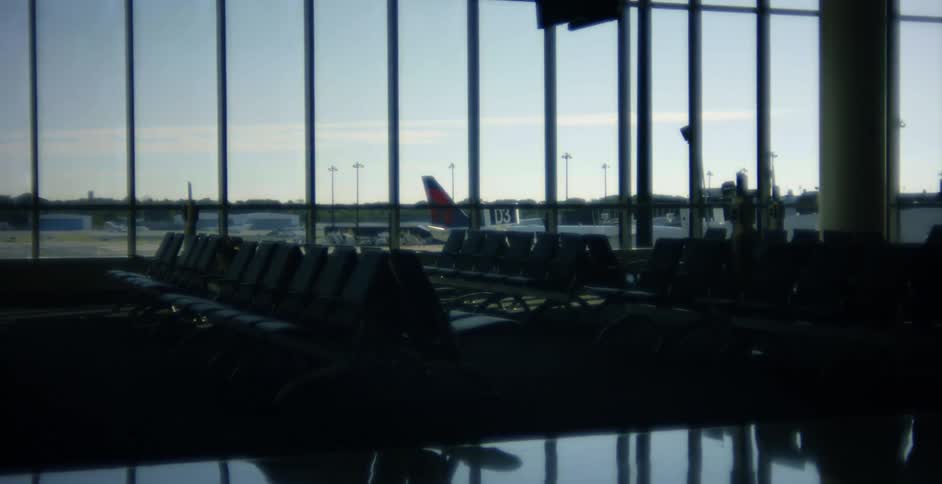 The empty waiting area of an airport during the day
