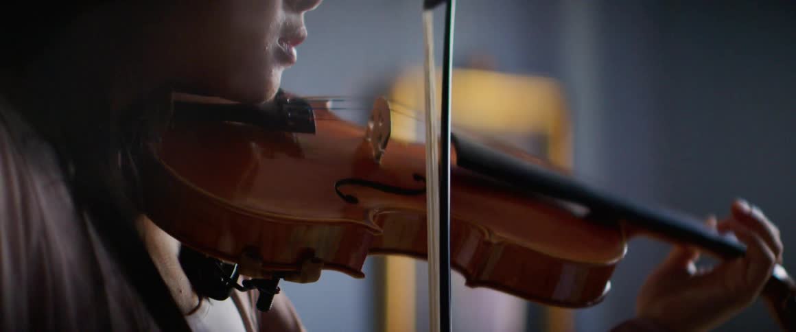 A woman is playing an instrument