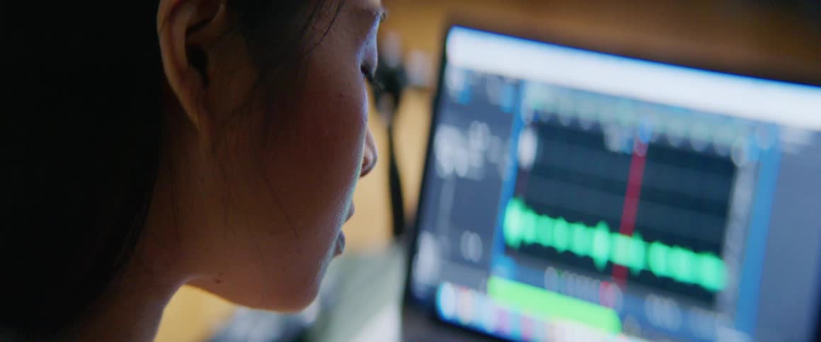 Asian woman is deeply concentrating while working on computer