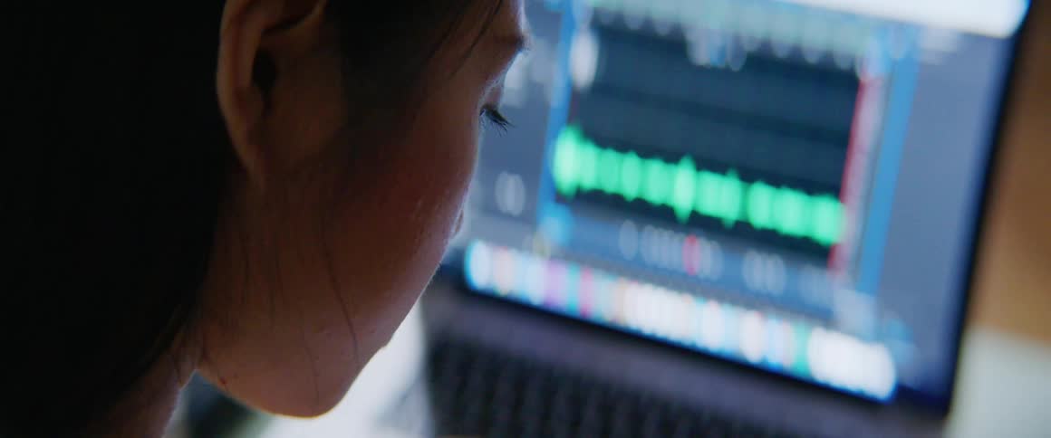 A woman is working on a laptop