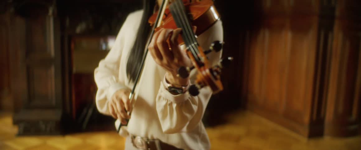 A woman is playing an instrument indoors
