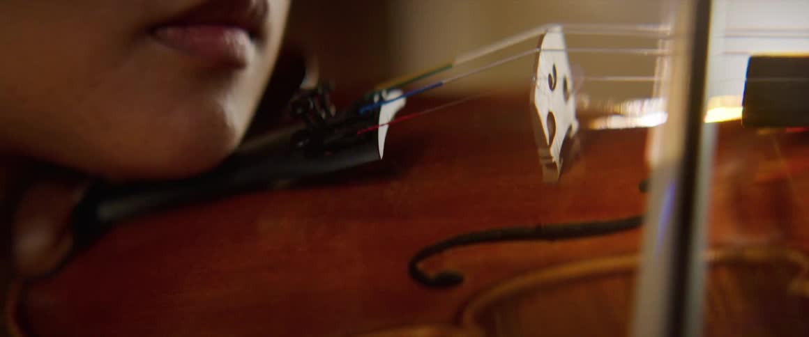 A woman is playing a musical instrument