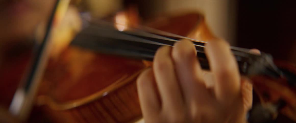 A woman is playing an instrument