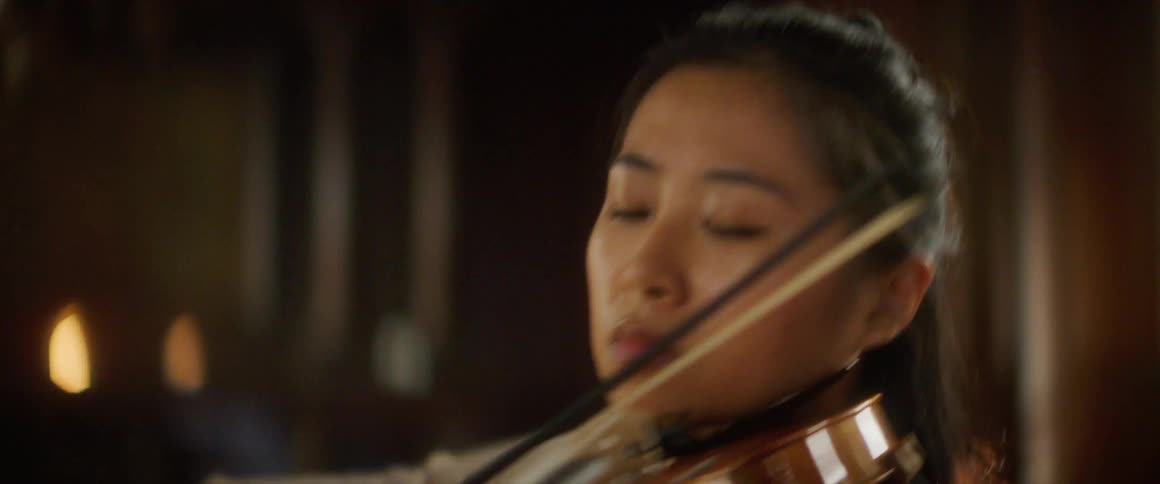 A woman is playing an instrument