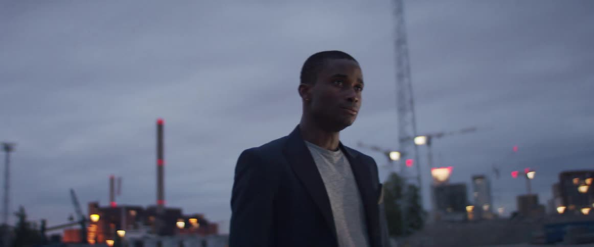 A man is walking in an urban city