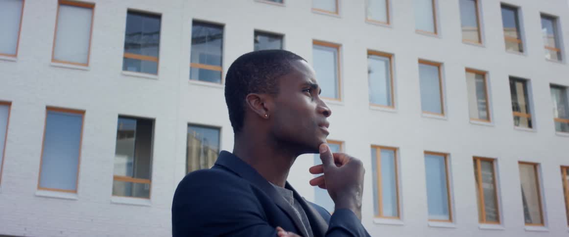 A man is looking over at the building
