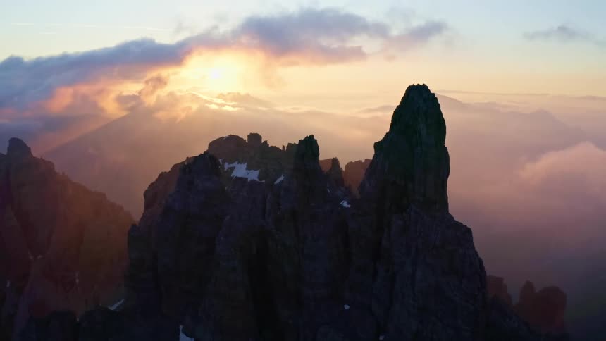 Aerial view of mountains at dusk is displayed
